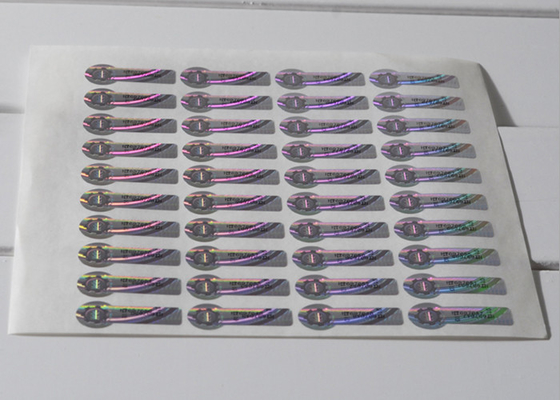 Cor - etiqueta de prata em mudança do holograma da segurança com o risco fora do código